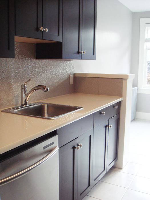 Renovated kitchen with stainless appliances at Beaufort Mansions