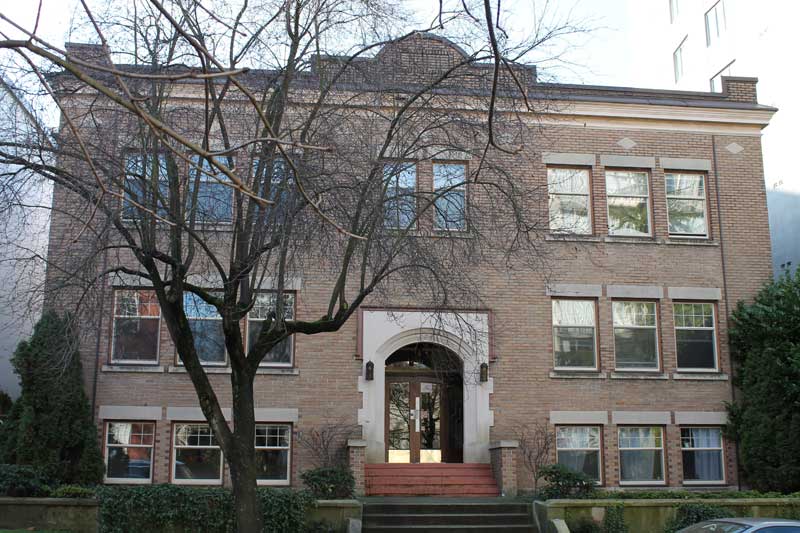 Brick and stone facade of Seafield Apartments at 1436 Pendrell Street