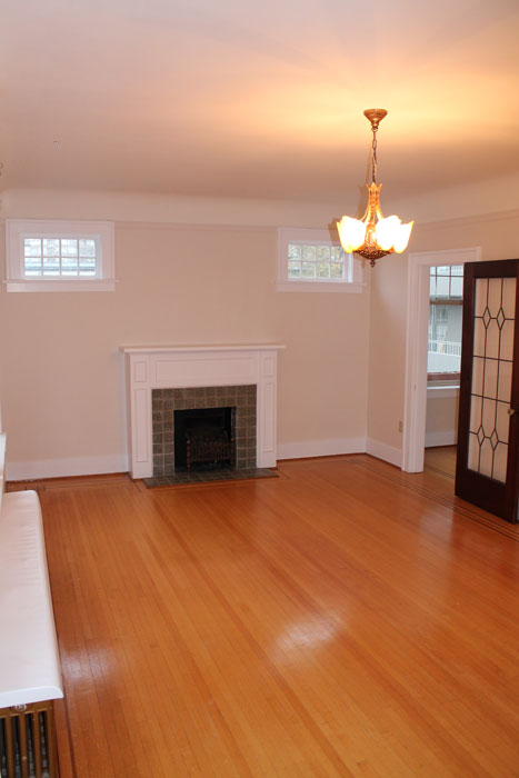 Living room with fireplace at Seafield Apartments