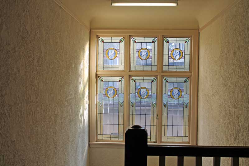 Stained glass stairwell windows at Seafield Apartments